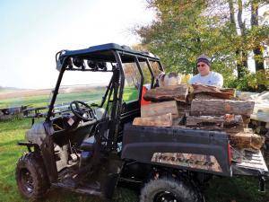 2012.polaris.ranger500efi.camo_.left_.parked.hauling-wood.jpg